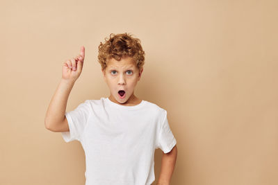 Portrait of boy gesturing