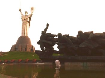 Low angle view of statue against sky