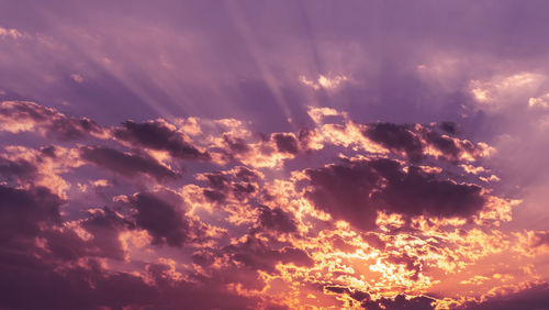 Low angle view of dramatic sky during sunset