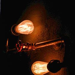 Close-up of illuminated light bulb