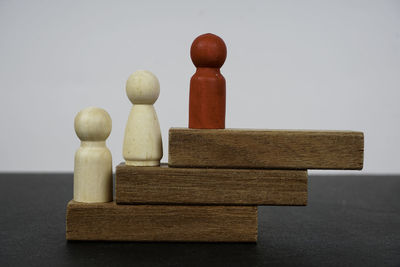 Close-up of stuffed toy on table against white background