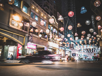 Illuminated city street at night