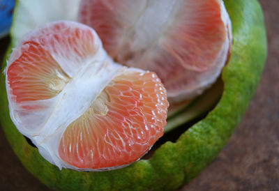 Close-up of peeled pummelo at table