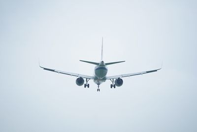 Low angle view of airplane against clear sky
