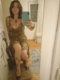 Portrait of woman holding smart phone at home