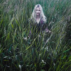 Portrait of woman by plants