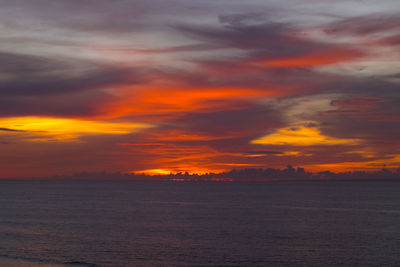 Scenic view of sea against romantic sky at sunset