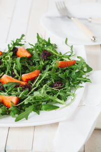 High angle view of vegetables in plate on table