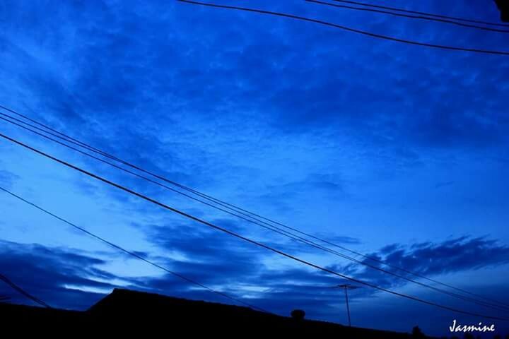 power line, electricity pylon, electricity, cable, power supply, sky, connection, low angle view, blue, power cable, silhouette, cloud - sky, fuel and power generation, cloud, technology, dusk, nature, beauty in nature, outdoors, no people