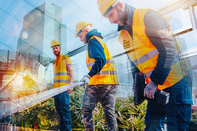 Rear view of man working at construction site