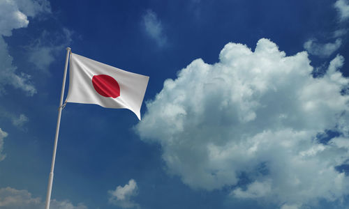 Low angle view of flag against sky