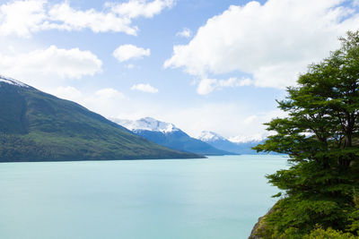 Scenic view of mountains and sea against sky