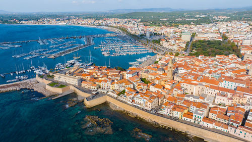 High angle view of townscape by sea