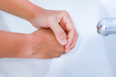 Close-up of hand holding hands