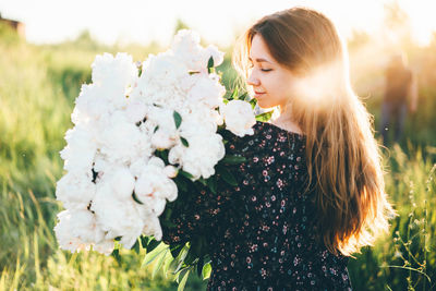 Rear view of woman with bouquet