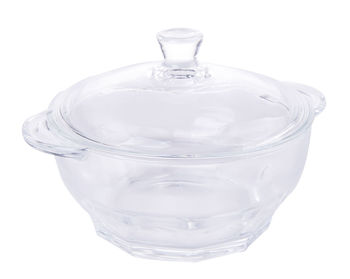 Close-up of glass container against white background