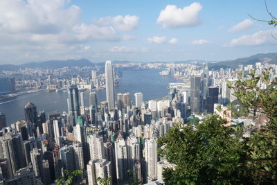 Aerial view of modern buildings in city against sky