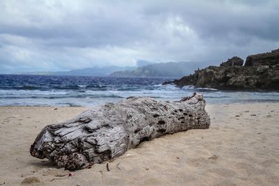 Scenic view of sea against cloudy sky