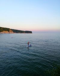 Scenic view of sea against clear sky during sunset