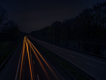 View of railroad tracks at night