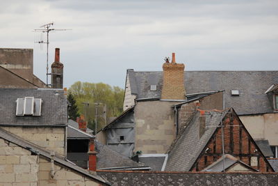 Houses in town against sky