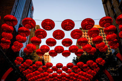 Low angle view of red lanterns hanging on the street