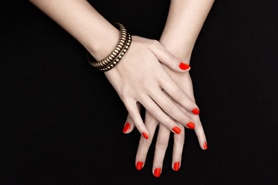 Close-up of human fingers with nail varnish