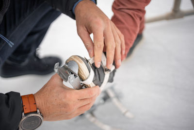 Midsection of man repairing car