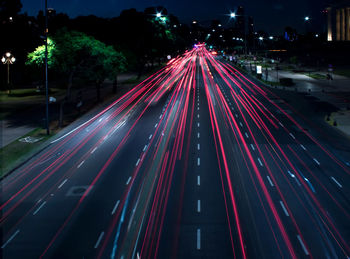 High angle view of light trails on road at night