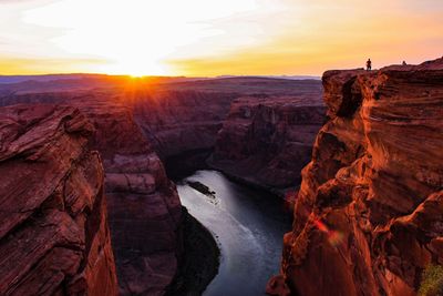 Scenic view of rocks against sky during sunset