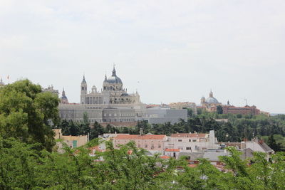 Buildings in city against sky