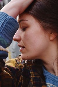 Close-up of young woman with eyes closed