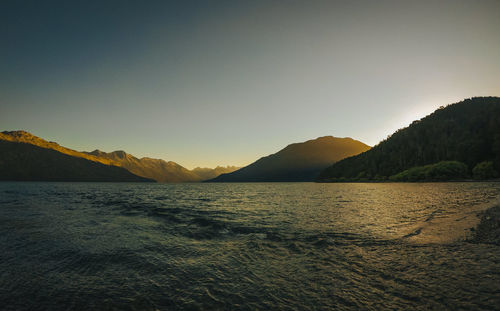 Scenic view of sea against clear sky during sunset