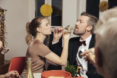 Couple drinking to close friendship on new year's eve