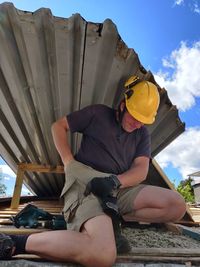 Man wearing hat against sky