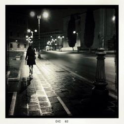 Full length of woman in city at night