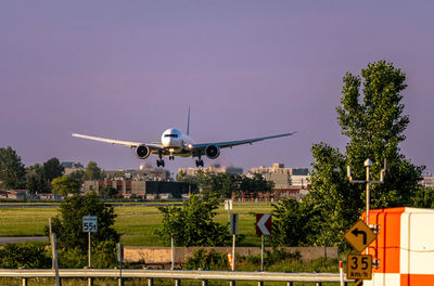 Airplane flying against clear sky