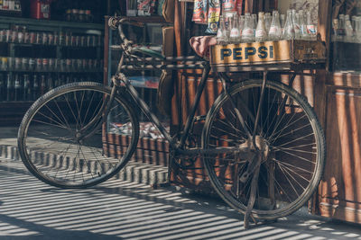 Bicycle parked on street in city