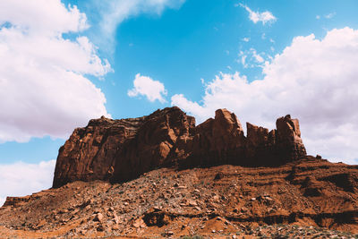 Low angle view of rock formation against sky