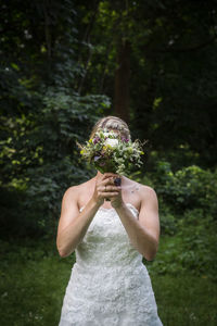 Rear view of bride holding a bouquet