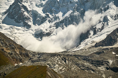 Scenic view of snowcapped mountains during winter