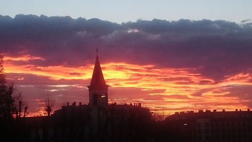 Silhouette of city during sunset