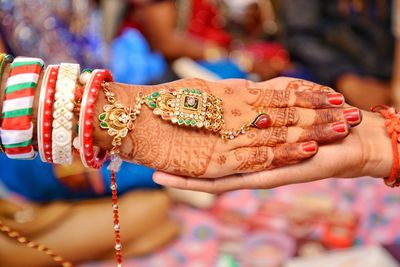 Cropped hands of bride and groom during wedding ceremony