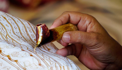 Close-up of hand holding food