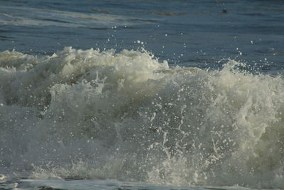 Waves splashing on shore