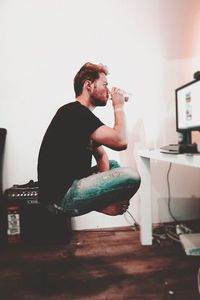 Young man smoking cigarette