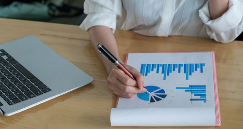 Low section of person working on table