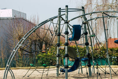 Bicycle on playground against sky