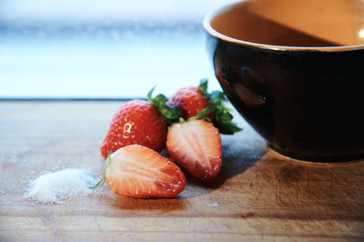 Close-up of chopped fruits on table