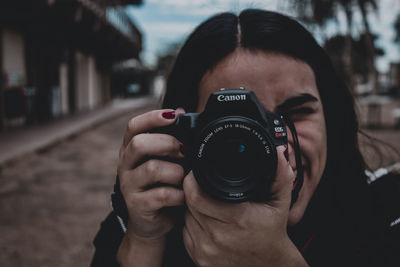 Portrait of man photographing